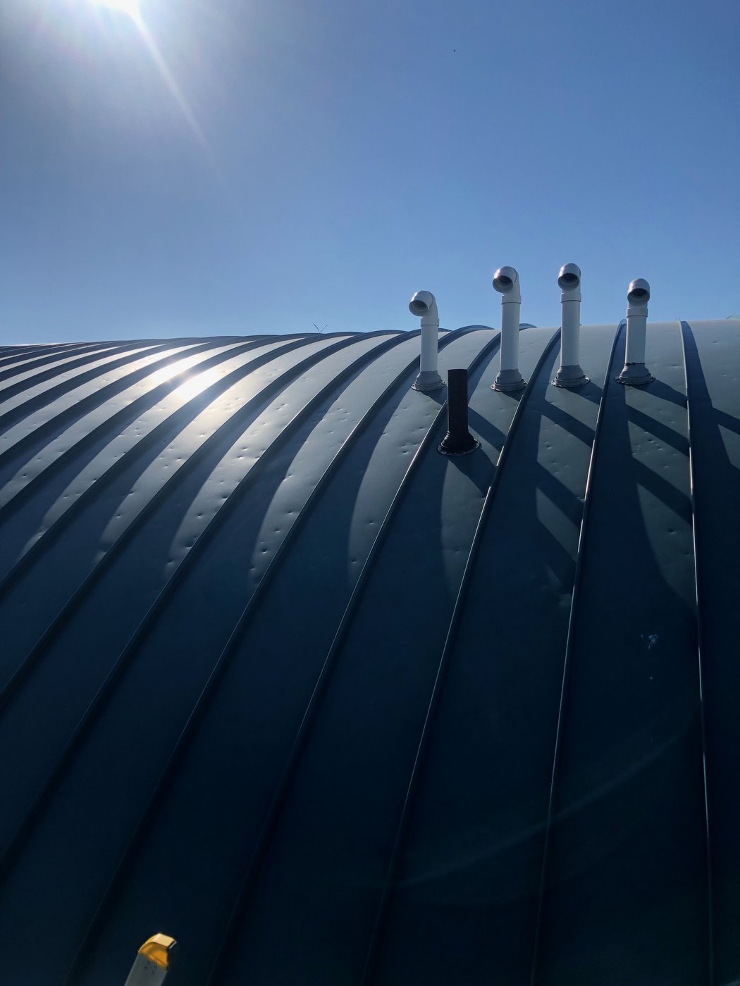 Curved standing-seam metal roof inspection